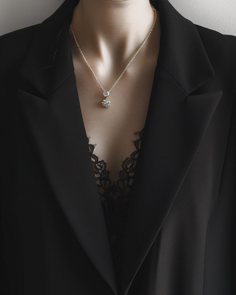 Structured black blazer styled in a minimalist romantic goth look